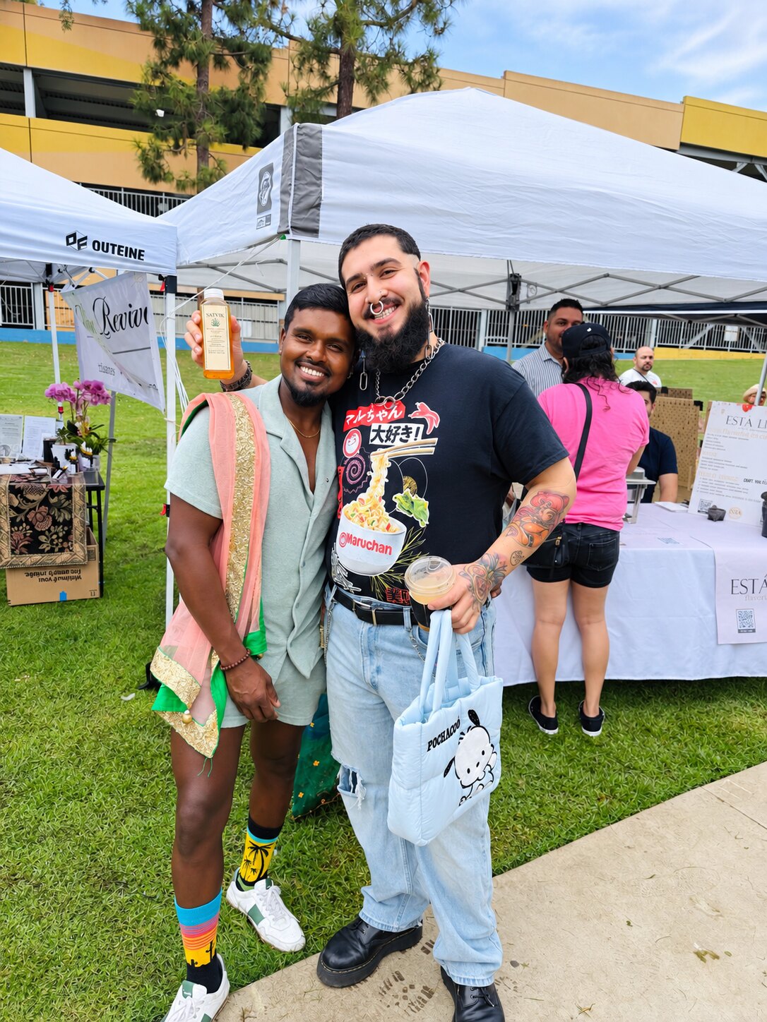 A community guest visiting the Satvik farmers market booth