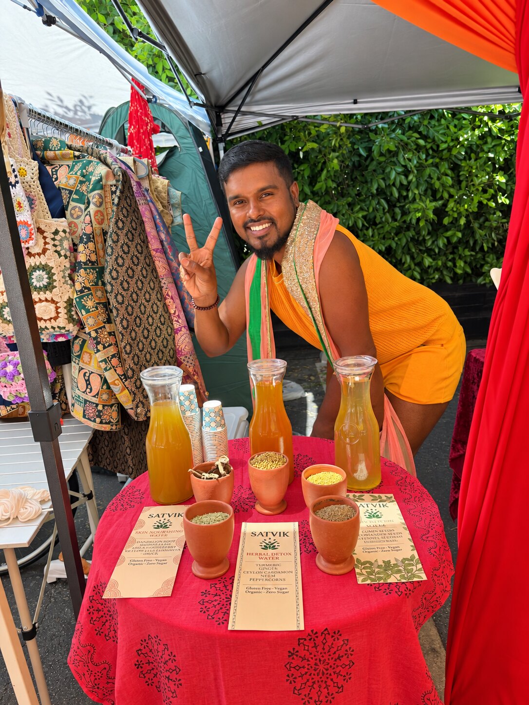 Satvik herbal waters displayed at an outdoor market table