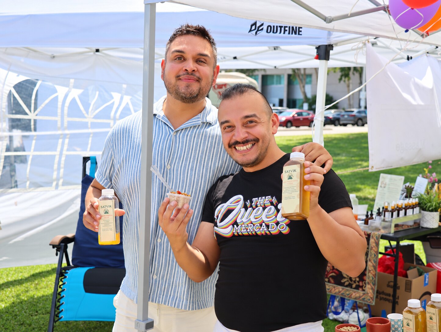 Satvik supporters enjoying herbal waters at an outdoor event